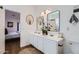 Bright bathroom with double sinks, contemporary mirrors, and modern fixtures at 3124 W Redbird Rd, Phoenix, AZ 85083