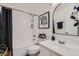 Stylish bathroom with a modern vanity, sleek mirror, and combined shower and tub at 3124 W Redbird Rd, Phoenix, AZ 85083
