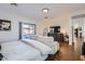 Bright, spacious bedroom with hardwood floors, lounge area and access to the backyard at 3124 W Redbird Rd, Phoenix, AZ 85083