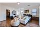 Comfortable main bedroom featuring hardwood floors, large windows and natural light at 3124 W Redbird Rd, Phoenix, AZ 85083