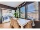 Bright dining room with a white table, stylish chairs, and sliding glass doors to the patio at 3124 W Redbird Rd, Phoenix, AZ 85083