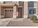 Close up of the front entrance with a two-car garage and neat landscaping at 3124 W Redbird Rd, Phoenix, AZ 85083