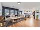 Spacious open concept living room featuring light wood floors and seamless access to the kitchen at 3124 W Redbird Rd, Phoenix, AZ 85083