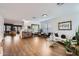 Bright living room with light wood floors, stylish decor, and ample natural light at 3124 W Redbird Rd, Phoenix, AZ 85083