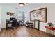 Bright home office features natural light, wood floors, and tasteful decor for a productive workspace at 3124 W Redbird Rd, Phoenix, AZ 85083