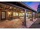 Cozy covered patio with brick flooring and outdoor seating, perfect for evening relaxation at 3226 E Lazy Ln, Phoenix, AZ 85028