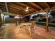 Relaxing covered patio with a ceiling fan, outdoor dining set, and cozy seating area at 3226 E Lazy Ln, Phoenix, AZ 85028