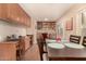 Open dining area features a built-in desk, cabinets, and shelving, offering workspace and storage at 3226 E Lazy Ln, Phoenix, AZ 85028