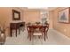 Elegant dining room with classic furnishings, soft lighting, and view to kitchen at 3226 E Lazy Ln, Phoenix, AZ 85028