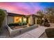Charming front exterior with sitting area, desert landscaping, and classic architectural features at 3226 E Lazy Ln, Phoenix, AZ 85028