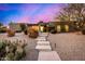 Stunning front exterior with desert landscaping, steps to entrance and charming architectural details at 3226 E Lazy Ln, Phoenix, AZ 85028