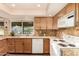 Bright kitchen with granite countertops, neutral backsplash, and stainless steel appliances offers backyard views at 3226 E Lazy Ln, Phoenix, AZ 85028
