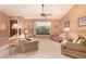 Inviting living room with large window overlooking scenic views, neutral tones, and ample seating at 3226 E Lazy Ln, Phoenix, AZ 85028