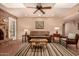Cozy living room with fireplace, comfortable seating, and lots of natural light at 3226 E Lazy Ln, Phoenix, AZ 85028