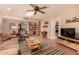 Inviting living room with skylight, built-in shelving, and tiled flooring at 3226 E Lazy Ln, Phoenix, AZ 85028