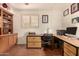 Home office with built-in storage and desk space, creating a functional and organized workspace at 3226 E Lazy Ln, Phoenix, AZ 85028