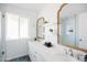 Bright, stylish bathroom with dual sinks, quartz countertop and framed mirrors at 3326 N 82Nd Pl, Scottsdale, AZ 85251