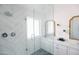 Bright bathroom with updated shower behind glass, white subway tile, and dual sink vanity at 3326 N 82Nd Pl, Scottsdale, AZ 85251