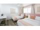 Inviting guest bedroom featuring two beds, neutral colors, and a charming decor at 3326 N 82Nd Pl, Scottsdale, AZ 85251