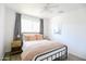 Cozy bedroom featuring stylish metal bed frame, wood nightstands, and light walls at 3326 N 82Nd Pl, Scottsdale, AZ 85251