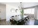 Elegant dining room featuring modern chandelier, large mirrors and wooden furniture for entertainment at 3326 N 82Nd Pl, Scottsdale, AZ 85251