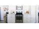 Kitchen boasts stainless steel appliances, subway tile backsplash and modern countertops for cooking at 3326 N 82Nd Pl, Scottsdale, AZ 85251