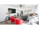Cozy living room with a large gray sectional, warm-toned decor, and a flat-screen TV at 3326 N 82Nd Pl, Scottsdale, AZ 85251