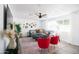 Bright living room with stylish decor, large gray sectional sofa, and natural light from a large window at 3326 N 82Nd Pl, Scottsdale, AZ 85251