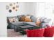 Comfortable living room featuring a gray sectional sofa, decorative wall art and an area rug at 3326 N 82Nd Pl, Scottsdale, AZ 85251