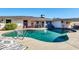 Backyard oasis with a sparkling pool and a covered patio area for outdoor living at 3326 N 82Nd Pl, Scottsdale, AZ 85251