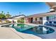 Well-maintained backyard pool and patio featuring outdoor seating and a BBQ grill at 3326 N 82Nd Pl, Scottsdale, AZ 85251