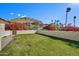 Inviting backyard showcasing a well-maintained lawn, desert landscaping, and scenic mountain views at 3500 E Lincoln Dr # 6, Phoenix, AZ 85018