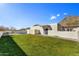 Spacious backyard featuring a well-maintained lawn and privacy wall at 3500 E Lincoln Dr # 6, Phoenix, AZ 85018