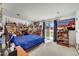 Bedroom with light carpet, a desk and sports décor, with sliding doors to the yard at 3500 E Lincoln Dr # 6, Phoenix, AZ 85018