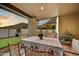Relaxing covered patio offering great dining with views of the manicured lawn and desert mountains at 3500 E Lincoln Dr # 6, Phoenix, AZ 85018