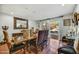 Elegant dining room with a large table, ornate mirror, and access to the patio at 3500 E Lincoln Dr # 6, Phoenix, AZ 85018