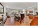 Elegant dining room with terracotta tile floors, patio access, and rustic furniture at 3500 E Lincoln Dr # 6, Phoenix, AZ 85018