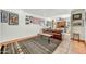 Comfortable living room featuring tiled floors, neutral color walls, area rug, and leather sofa at 3500 E Lincoln Dr # 6, Phoenix, AZ 85018