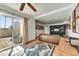 Bright living room with tile flooring, access to patio, leather couch, and built-in shelving at 3500 E Lincoln Dr # 6, Phoenix, AZ 85018