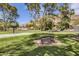 Community park with picnic tables, basketball court and mature trees at 3500 E Lincoln Dr # 6, Phoenix, AZ 85018