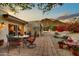 Outdoor patio with dining set, fountain, and mountain views creating a tranquil outdoor space at 3500 E Lincoln Dr # 6, Phoenix, AZ 85018