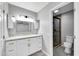 Updated bathroom featuring new cabinetry, granite countertop, and frameless glass shower door at 3523 W Kelton Ln, Phoenix, AZ 85053