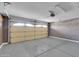 Spacious two-car garage with block walls and a roll-up door at 3523 W Kelton Ln, Phoenix, AZ 85053