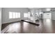 Open-concept living room and kitchen with raised seating, modern appliances, and tile flooring at 3523 W Kelton Ln, Phoenix, AZ 85053