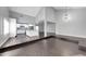 Bright living room showcasing high ceilings, open layout, and sleek, modern flooring at 3523 W Kelton Ln, Phoenix, AZ 85053