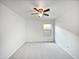 Cozy bedroom with plush carpeting, ceiling fan, and a bright window at 40995 W Portis Dr, Maricopa, AZ 85138