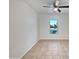Bright bedroom with a ceiling fan and natural light from the window at 40995 W Portis Dr, Maricopa, AZ 85138