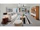 Bright living room with modern decor, stylish furniture, and plenty of natural light at 40995 W Portis Dr, Maricopa, AZ 85138