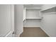 Spacious walk-in closet with ample shelving and storage space at 40995 W Portis Dr, Maricopa, AZ 85138
