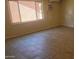 Bright room with window and tiled floors at 4124 E Apollo Rd, Phoenix, AZ 85042